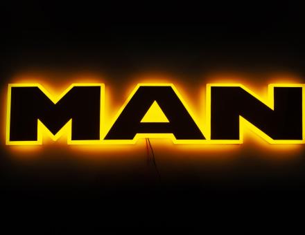 Надпис на решітку Man нержавійка з оранжевою підсвіткою (63см.*13,5см.)