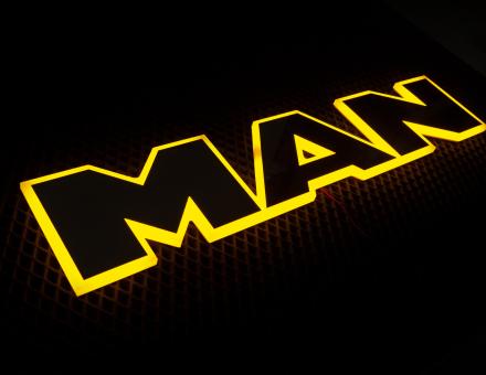 Надпис на решітку Man нержавійка з оранжевою підсвіткою (63см.*13,5см.)